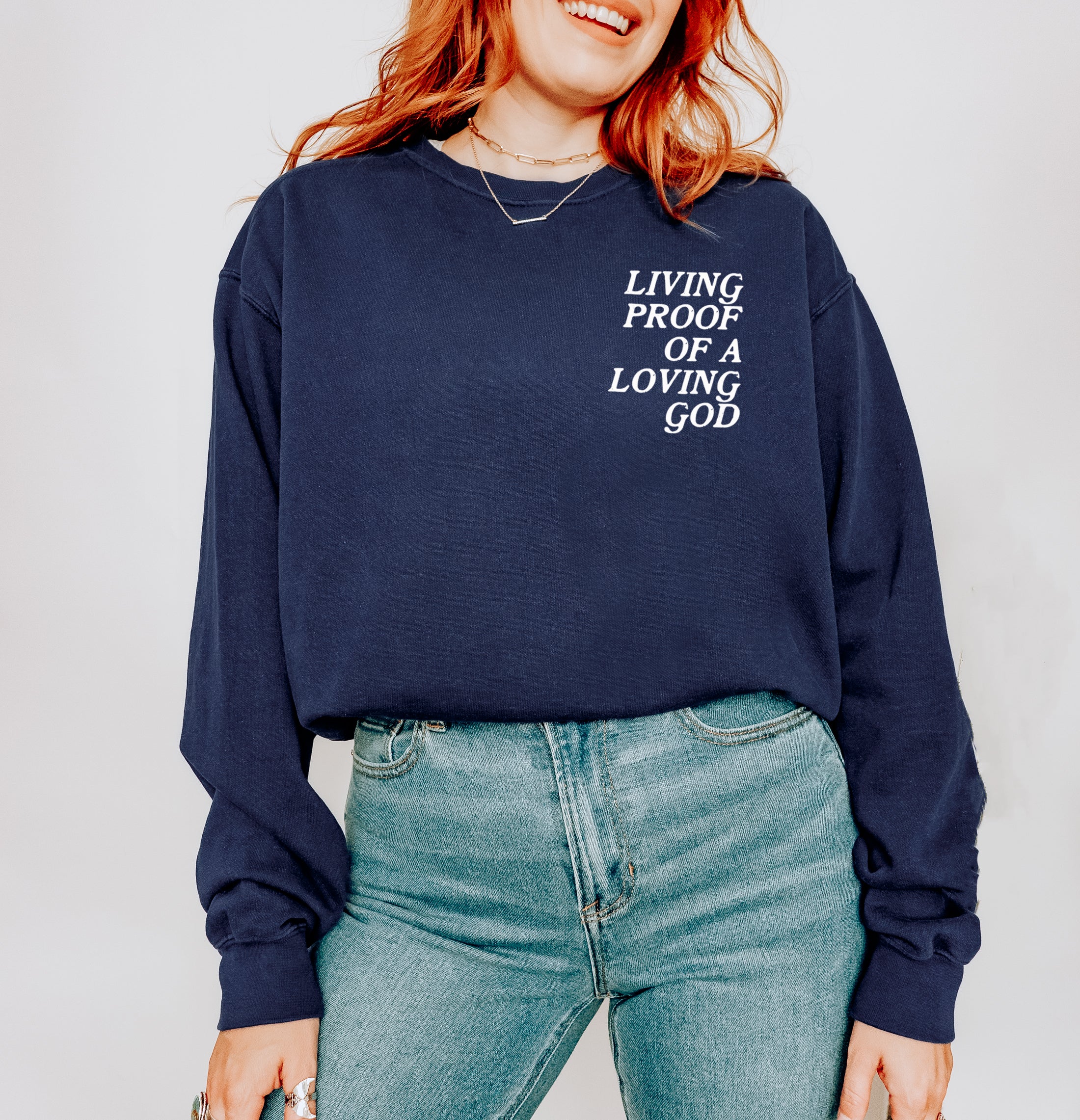 LIVING PROOF OF A LOVING GOD UNISEX SWEATSHIRT