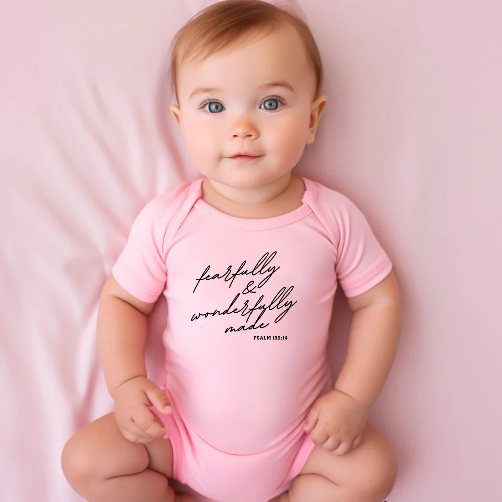 "FEARFULLY AND WONDERFULLY MADE" BODYSUIT IN PINK