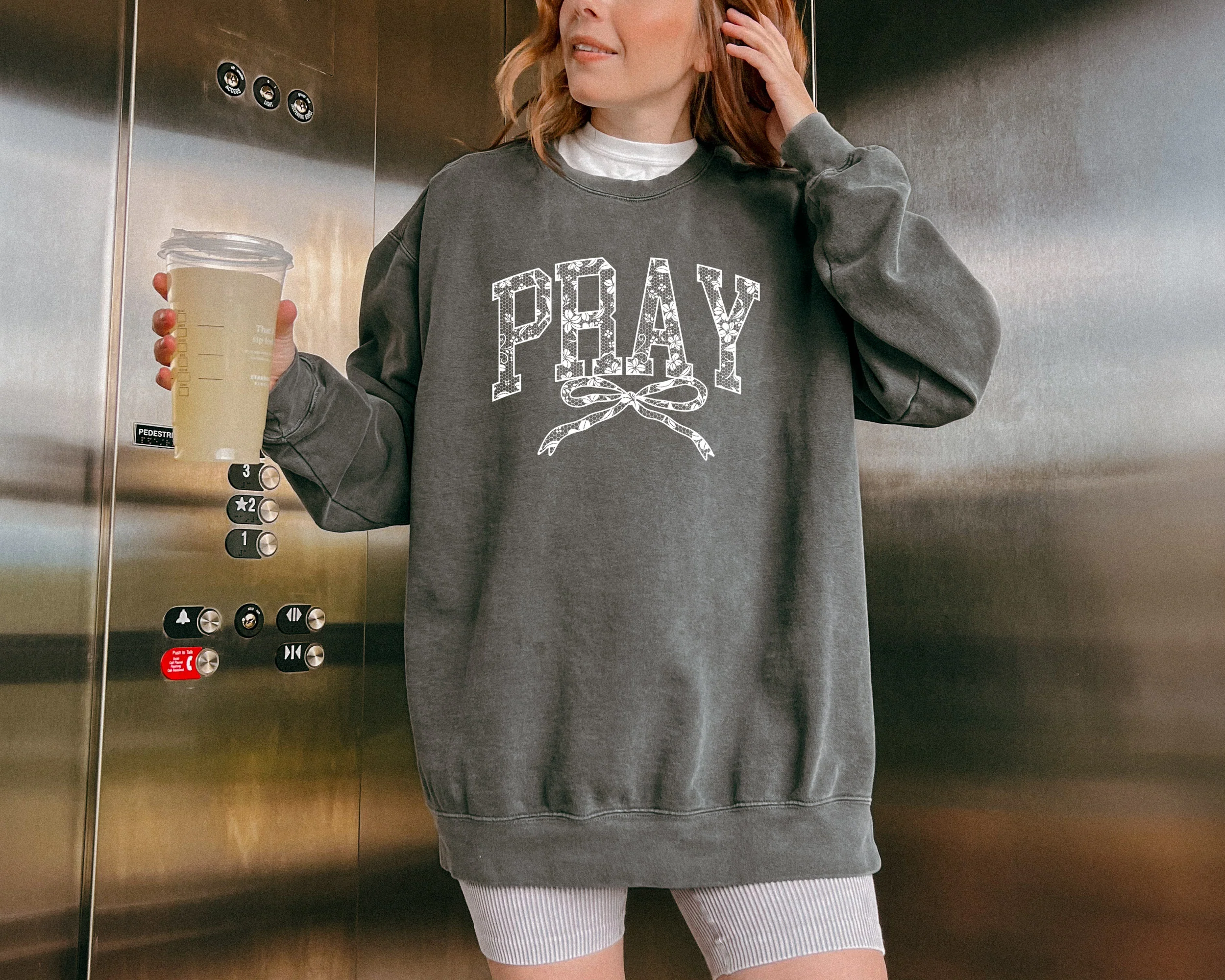PRAY WITH A BOW UNISEX SWEATSHIRT